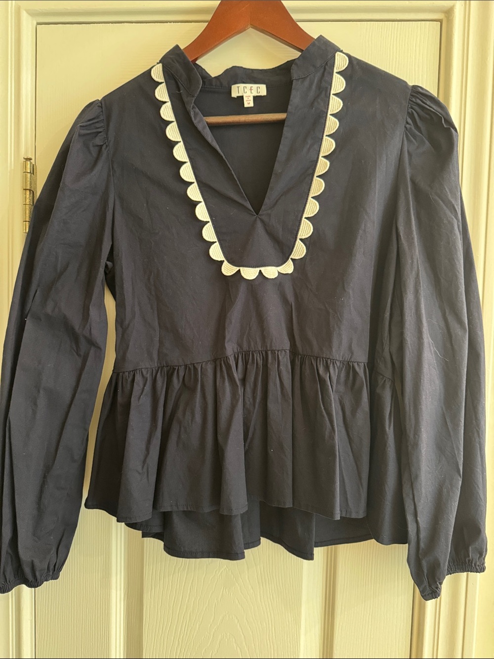 TCEC Navy Peplum Blouse with Cream Scalloped Trim
